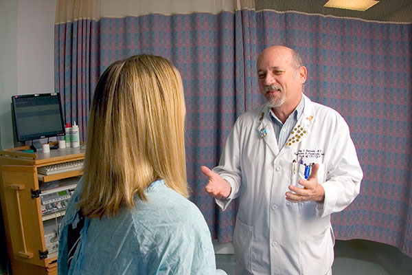 University of Florida gynecologic oncologist meets with patient.